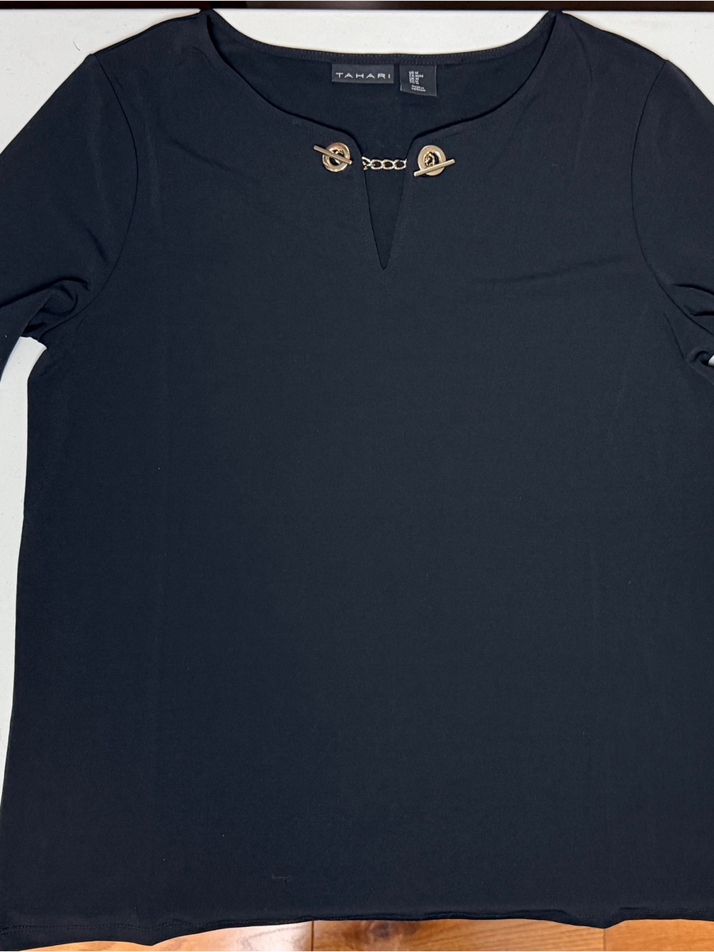 Tahari Black Long-Sleeve Top with Gold Chain Accent
